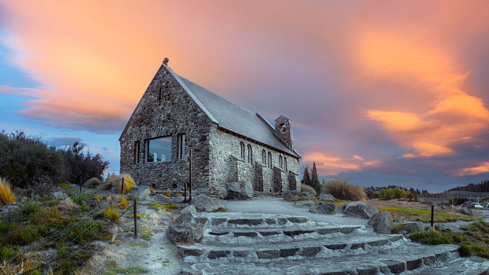 Stone church on a hill at sunset